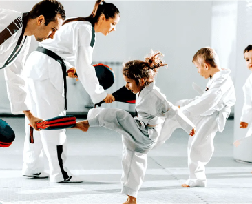 philosophy of Hapkido is shown here with a family learning hapkido dressed in their robes on a mat