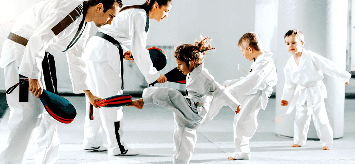 philosophy of Hapkido is shown here with a family learning hapkido dressed in their robes on a mat